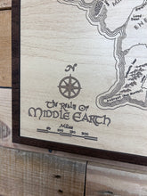 Load image into Gallery viewer, Wooden plaque with engraved map of Middle-earth and 'The Lord of the Rings' logo.