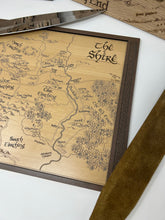 Load image into Gallery viewer, Wooden map of 'The Shire' with a brown frame on a white surface.