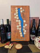 Load image into Gallery viewer, Seneca Lake Winery Map in cherry wood with maple winery logo tokens pre-installed, hanging on a wall