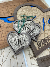 Load image into Gallery viewer, Wooden map with heart-shaped pendants
